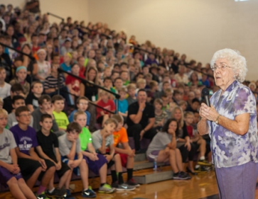 Edie speaks to Otte Assembly in gymnasium