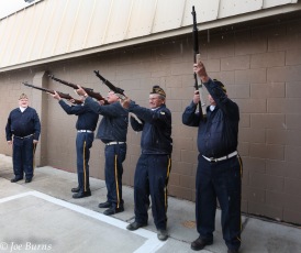 Soldiers fire rifles