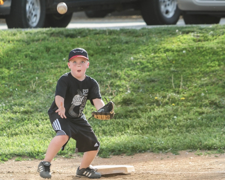 Little League player Kater Scott keeps his eye on the ball. 