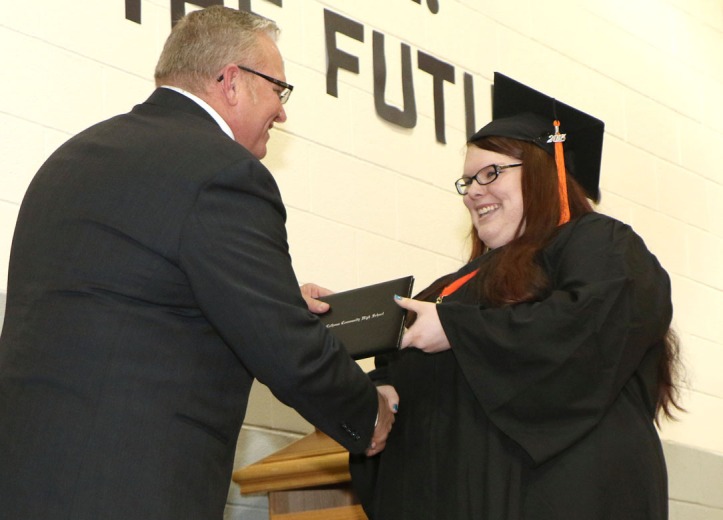 Emily Johnson receives diploma from Mike Conrad