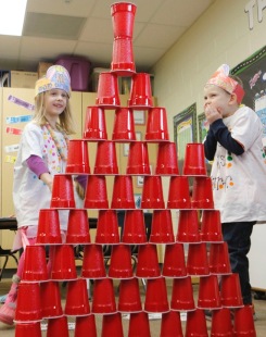 Fort Calhoun kindergarten students celebrate the 100th day of school by counting collecting and stacking 100 items.