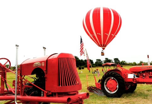 Antique tractors and farm machinery lined entry way the Fort Atkinson stockade. In the background Rich Jaworski Heritage Days offered guests an aerial view of Fort Atkinson Saturday morning from his tethered hot air balloon.